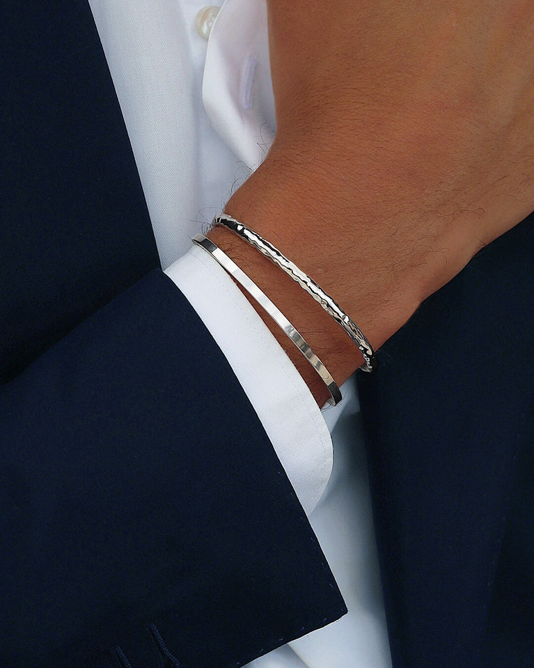 A Square Bangle in 925 Sterling Silver from Waldor & Co. The model is Pure Bangle Sterling Silver