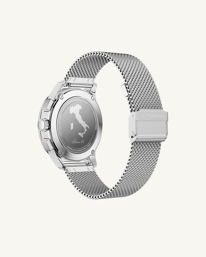 A round womens watch in rhodium-plated silver from Waldor & Co. with turquoise sunray dial and a second hand. Seiko movement. The model is Chrono 36 Sardinia 36mm.