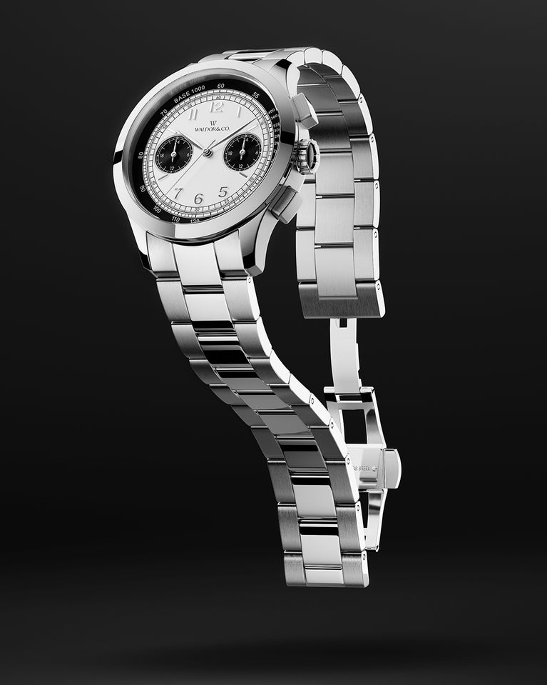 A round mens watch in rhodium-plated silver from Waldor & Co. with black and white sunray dial and a second hand. Seiko movement. The model is Chrono 39 Panda Ltd. Edition