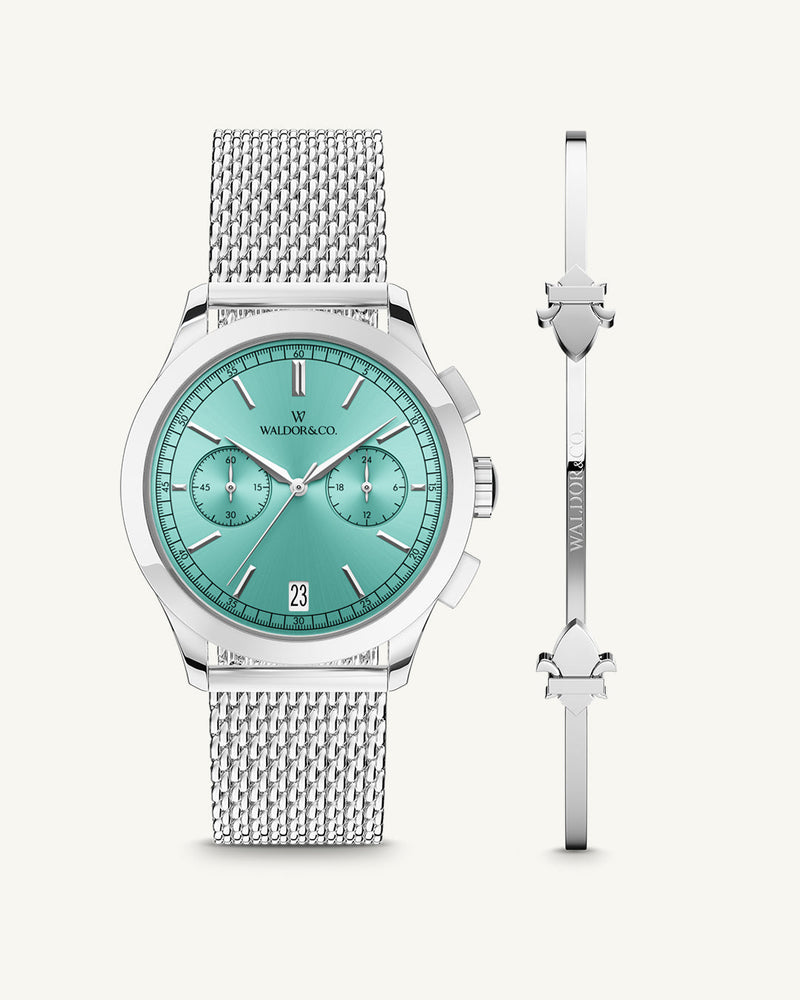 A round mens watch in rhodium-plated silver from Waldor & Co. with turquoise sunray dial and a second hand. Seiko movement. The model is Chrono 39 Sardinia 39mm.