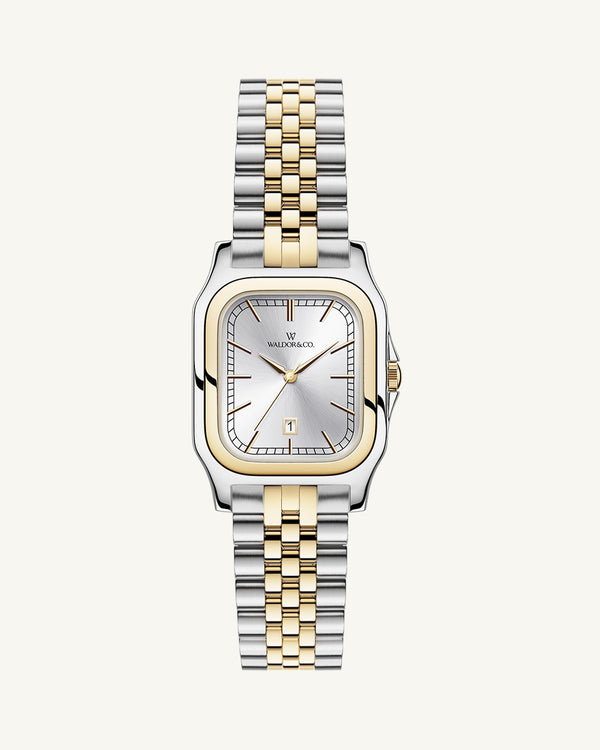 A square womens watch in silver and 14k gold from Waldor & Co. with silver sunray dial and a second hand. Seiko movement. The model is Delight 32 Chelsea 28x32mm.