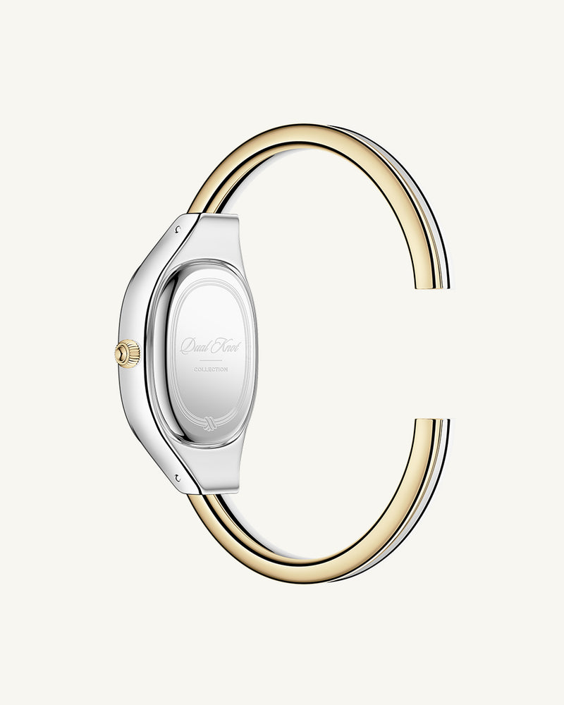 An ellipse shaped womens watch in Rhodium-plated 316L stainless steel from Waldor & Co. with silver sunray dial in brass. Mineral glass with sapphire crystal coating. Seiko movement. The model is Dual Bangle Watch.