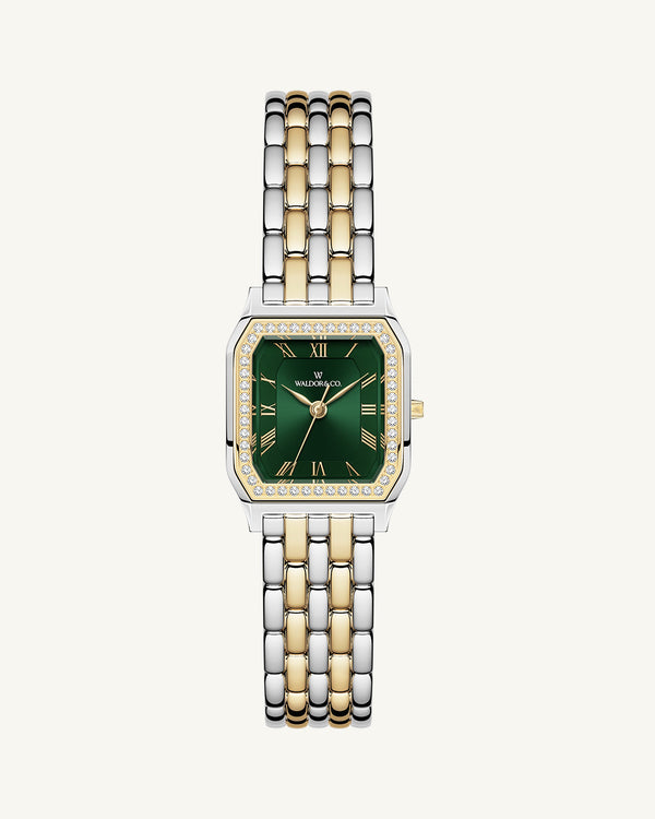 A square womens watch in Rhodium-plated 316L stainless steel from Waldor & Co. with emerald green dial. Bezel with premium crystals. Diamond Cut Sapphire Crystal glass dial. Seiko movement. The model is Eternal 22 Bellagio Pavè.