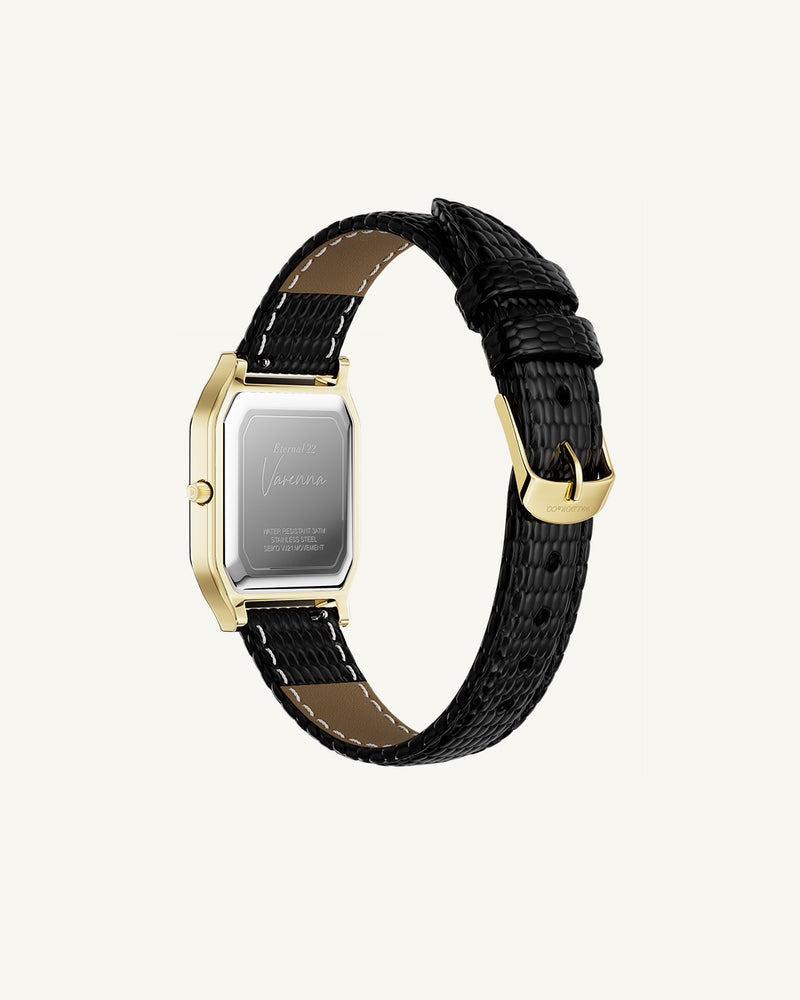 A square womens watch in 22k gold from Waldor & Co. with white Diamond Cut Sapphire Crystal glass dial. Strap in black Genuine leather. Seiko movement. The model is Eternal 22 Varenna. 