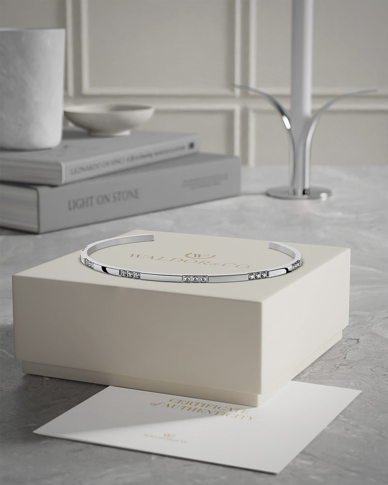 A Bangle in Rhodium-plated 316L stainless steel from Waldor & Co. One size. The model is Opulent Bangle Polished.