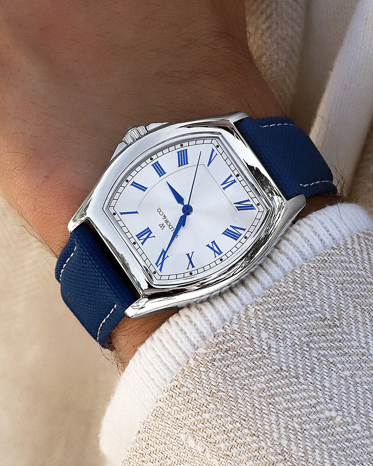  A square mens watch in Rhodium-plated 316L stainless steel from Waldor & Co. with white dial. Blue sailcloth strap. Ronda movement. The model is Constant 40 Tremezzo 37x45mm.